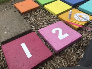 Colorful painted Hopscotch stepping stones backyard project