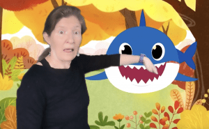 kira with shark virtual background for speech therapy
