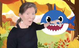 kira with green screen pocket feeding shark speech therapy